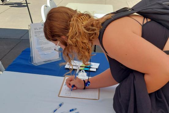 Student at Service Fair Booth