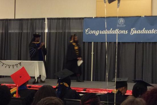Graduates walking the stage