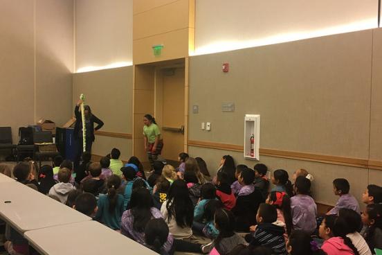 The kids interacting with storyteller, Laurie Cameron
