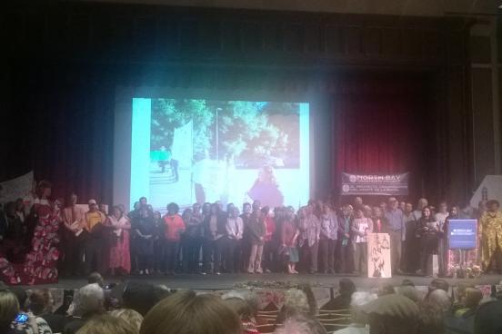 Audience members were asked to join speakers on stage by tenet and member for the Centro Laboral de Graton and Integrated Voter Engagement Team