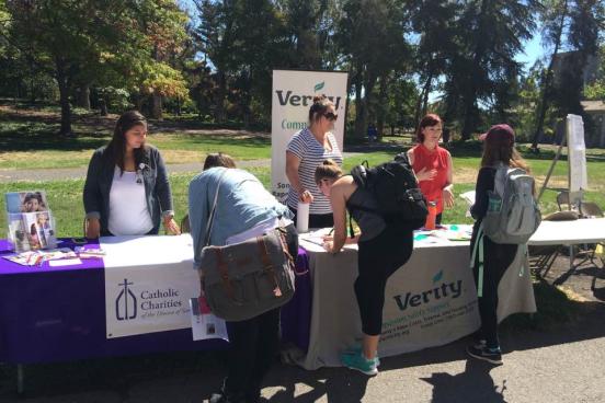 Students signing up for opportunities from Catholic Charities and Verity at the 2016 Fair. Students signing up for opportunities from Catholic Charities and Verity at the 2016 Fair.