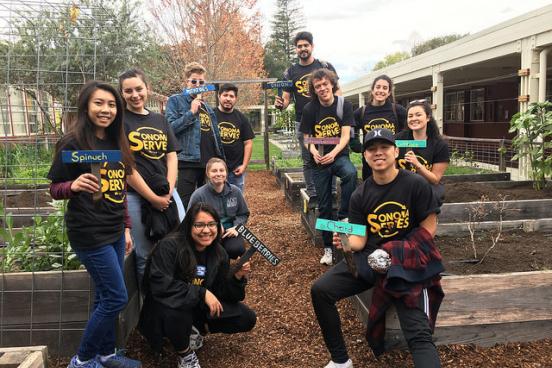 A group of students poses for a photo at Sonoma Serves