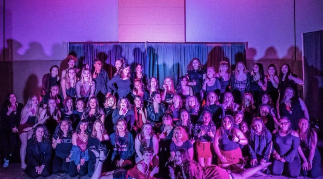 The cast of the show pose for a photo
