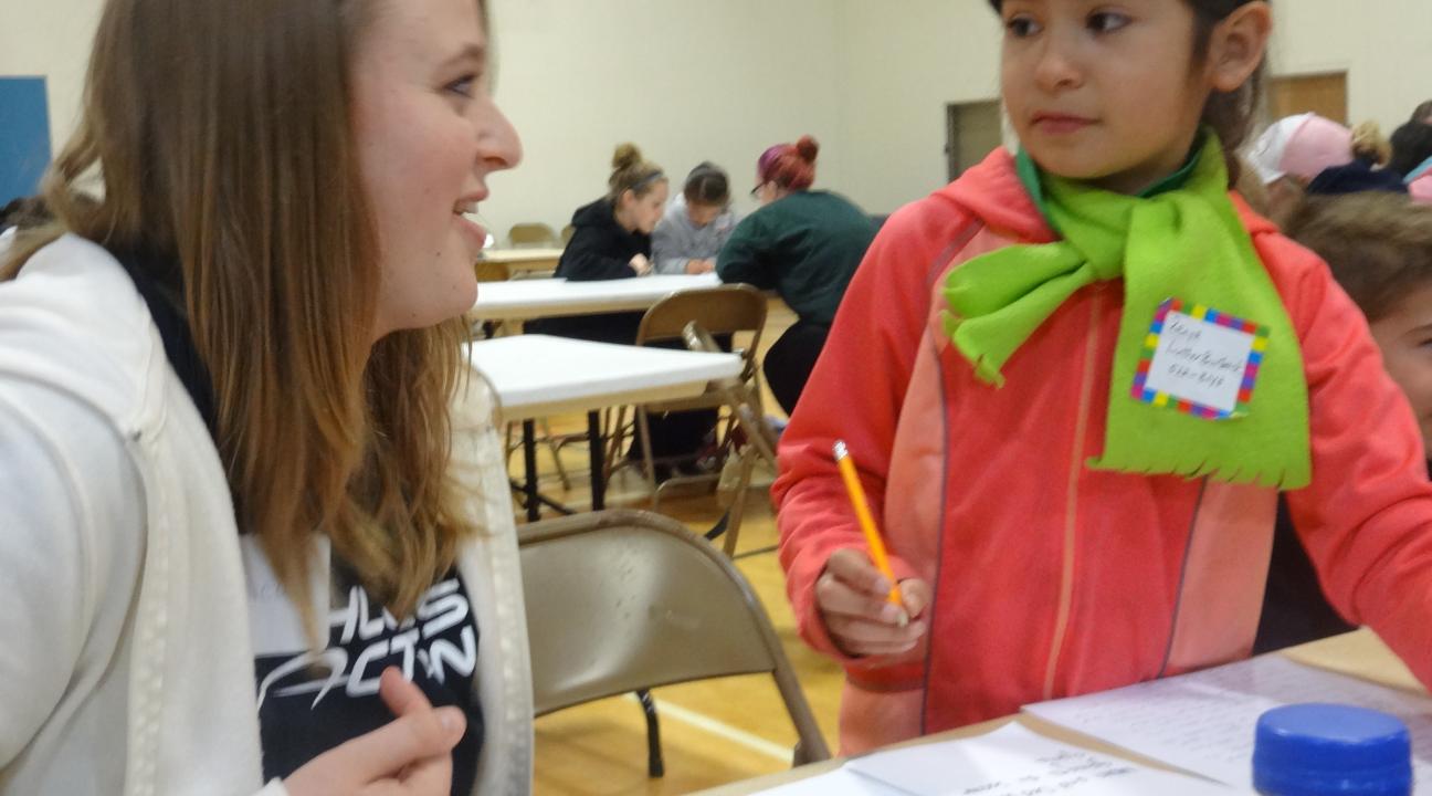 Luther Burbank student book author and illustrator collaborating with SSU service-learner.