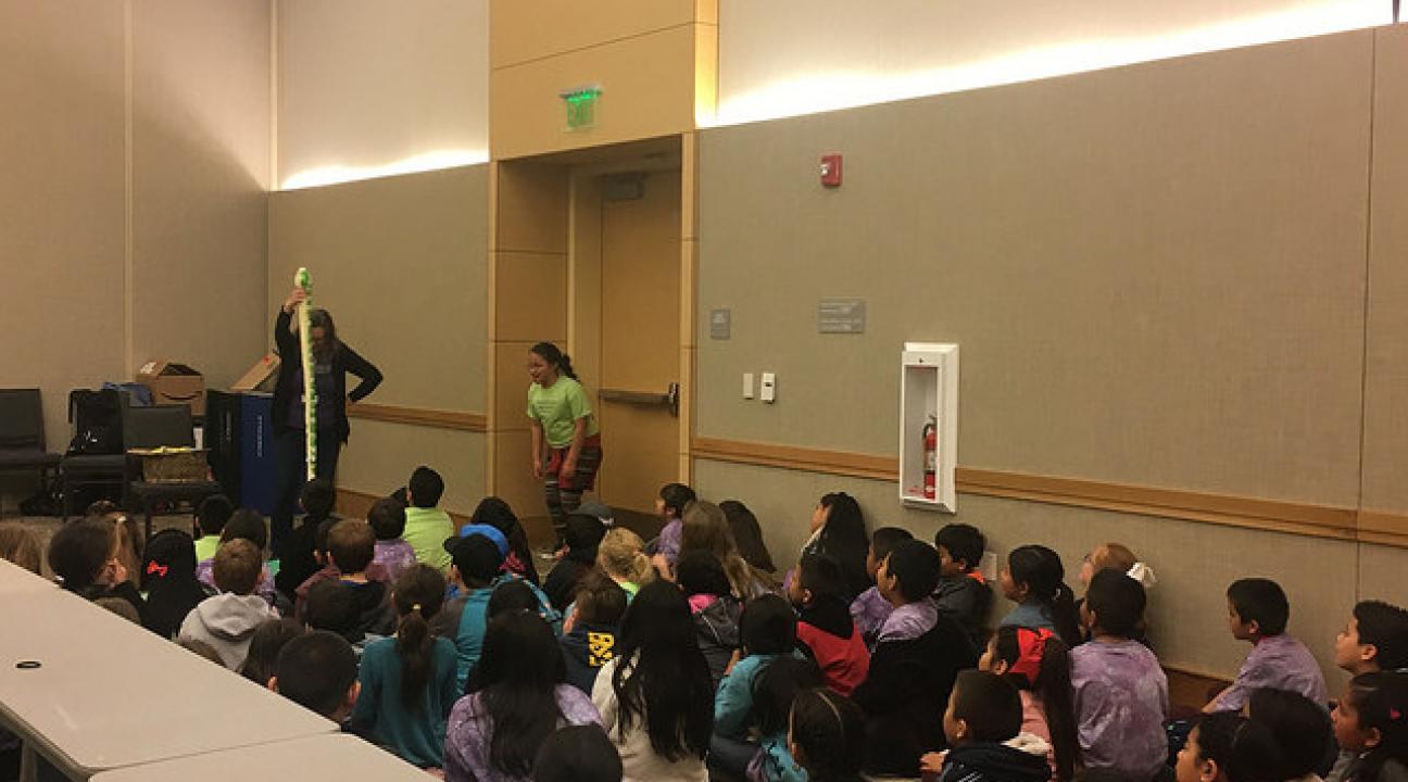 The kids interacting with storyteller, Laurie Cameron