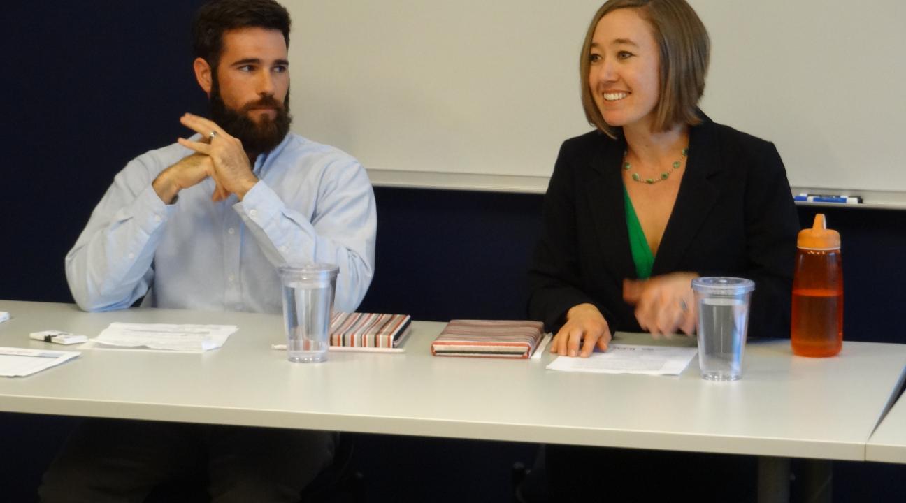 Panelists Sean and Angie answering questions on the rewards of service.
