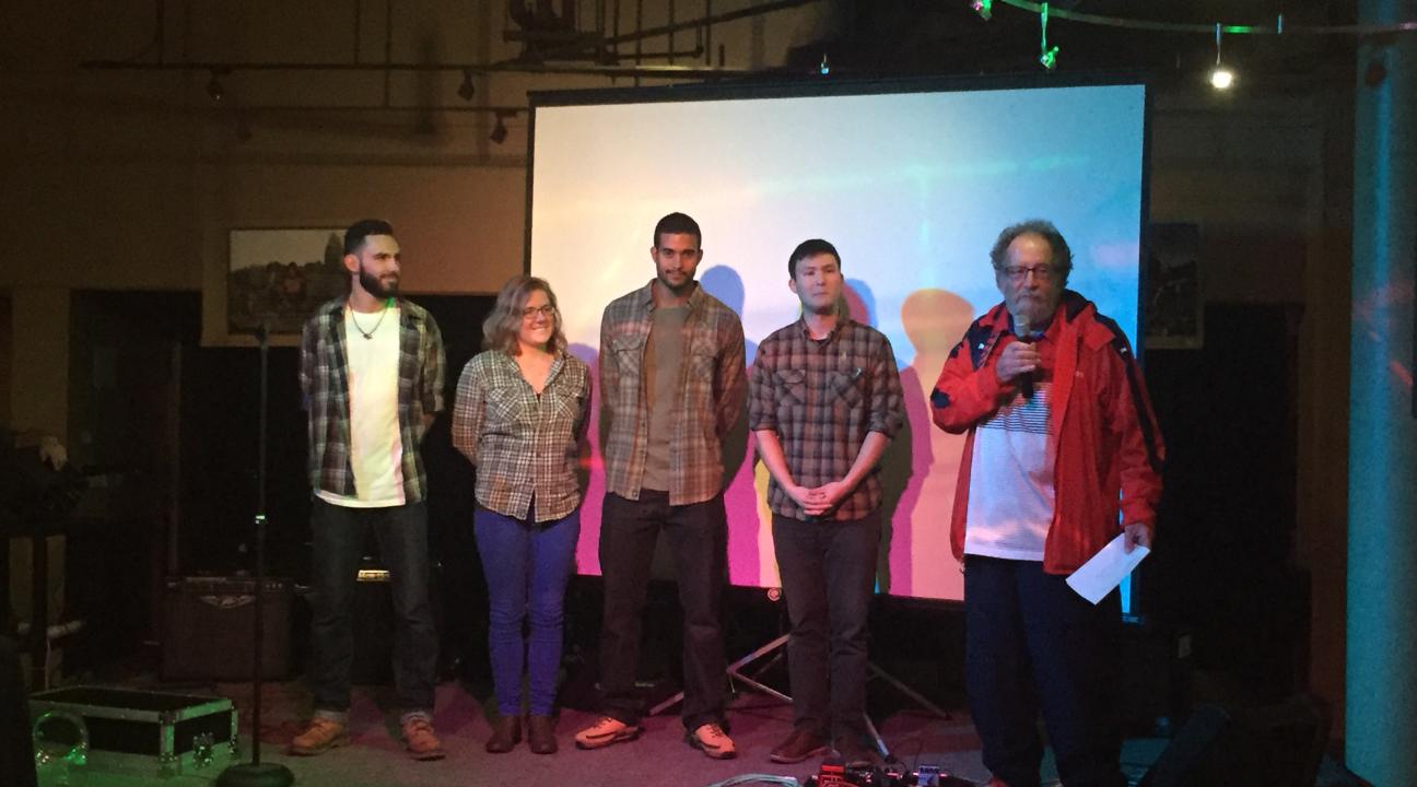 Dustin Dematteo, Allison Jenks, Jamal Edwards, and Tomio Endo on stage with Vice Mayor Jake Mackenzie presenting their mission statement.