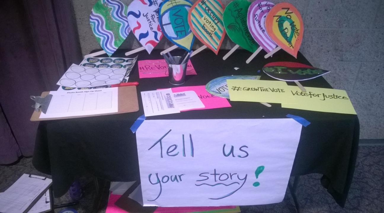 A table outside the meeting encouraging people to vote.