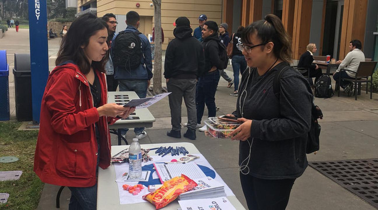 Jackeline giving a student more information on what the Peace Corps entails