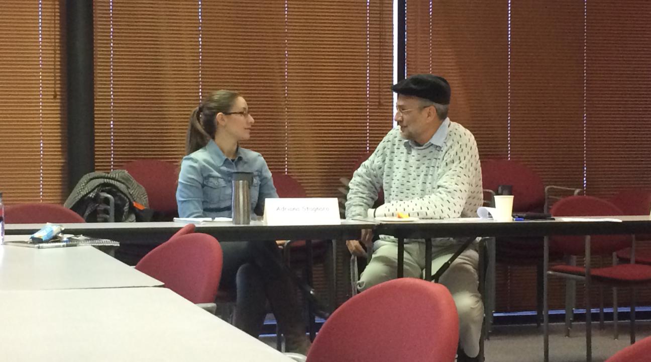 Two professionals networking before the Roundtable started.