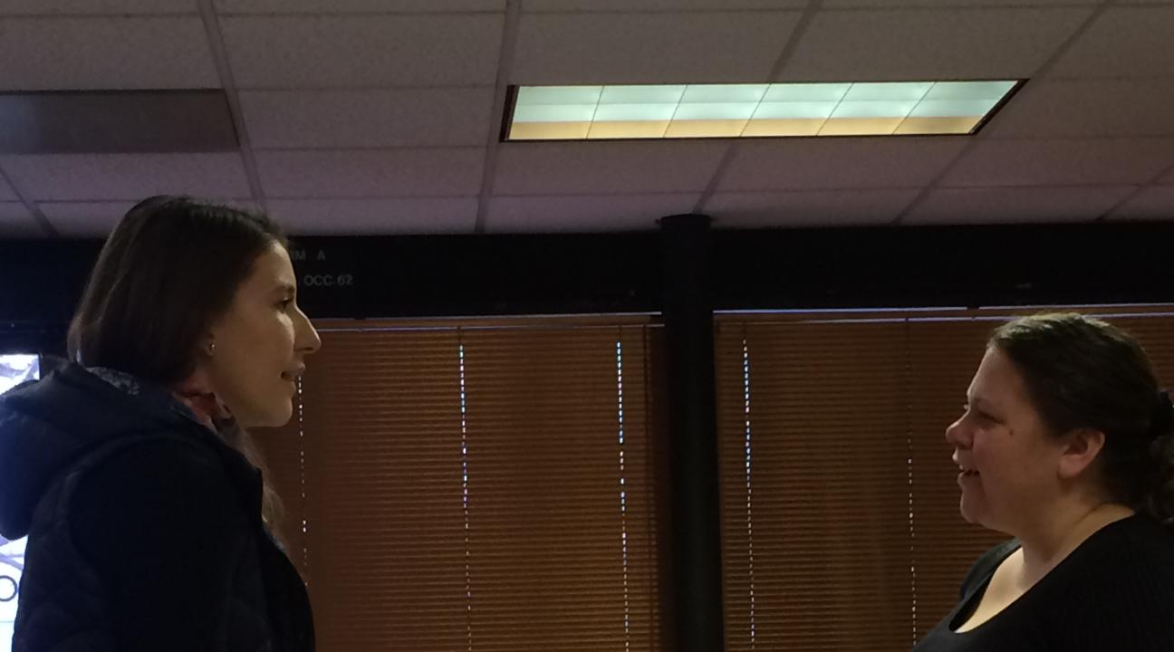 Shannon Carr (right) and a colleague discussing what they learned at the Roundtable.