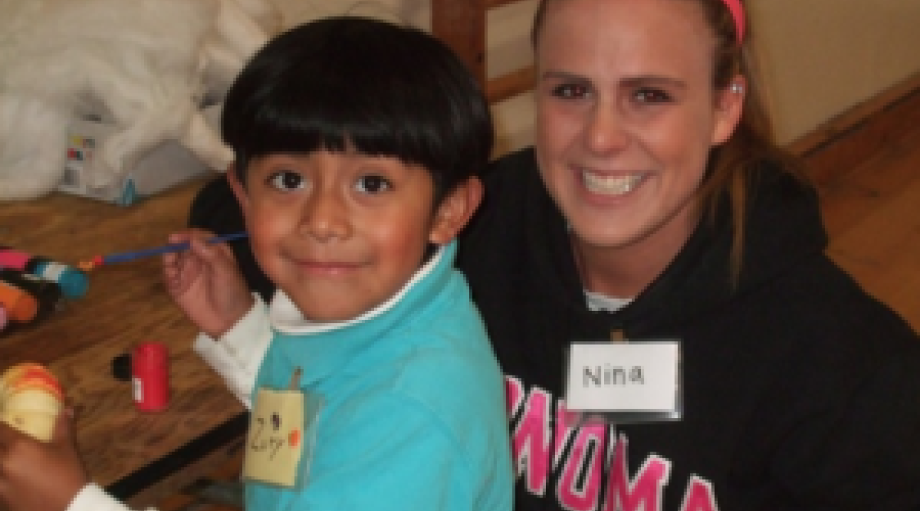 Nina Cragg, a volunteer from the CATS program and Zuriel Santiago, the sibling of a Sat Sidekicks participant.