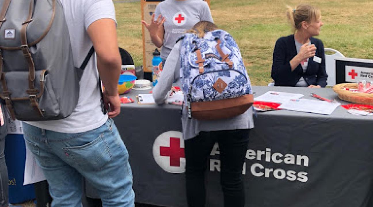 Student at the Red Cross table at a resource fair