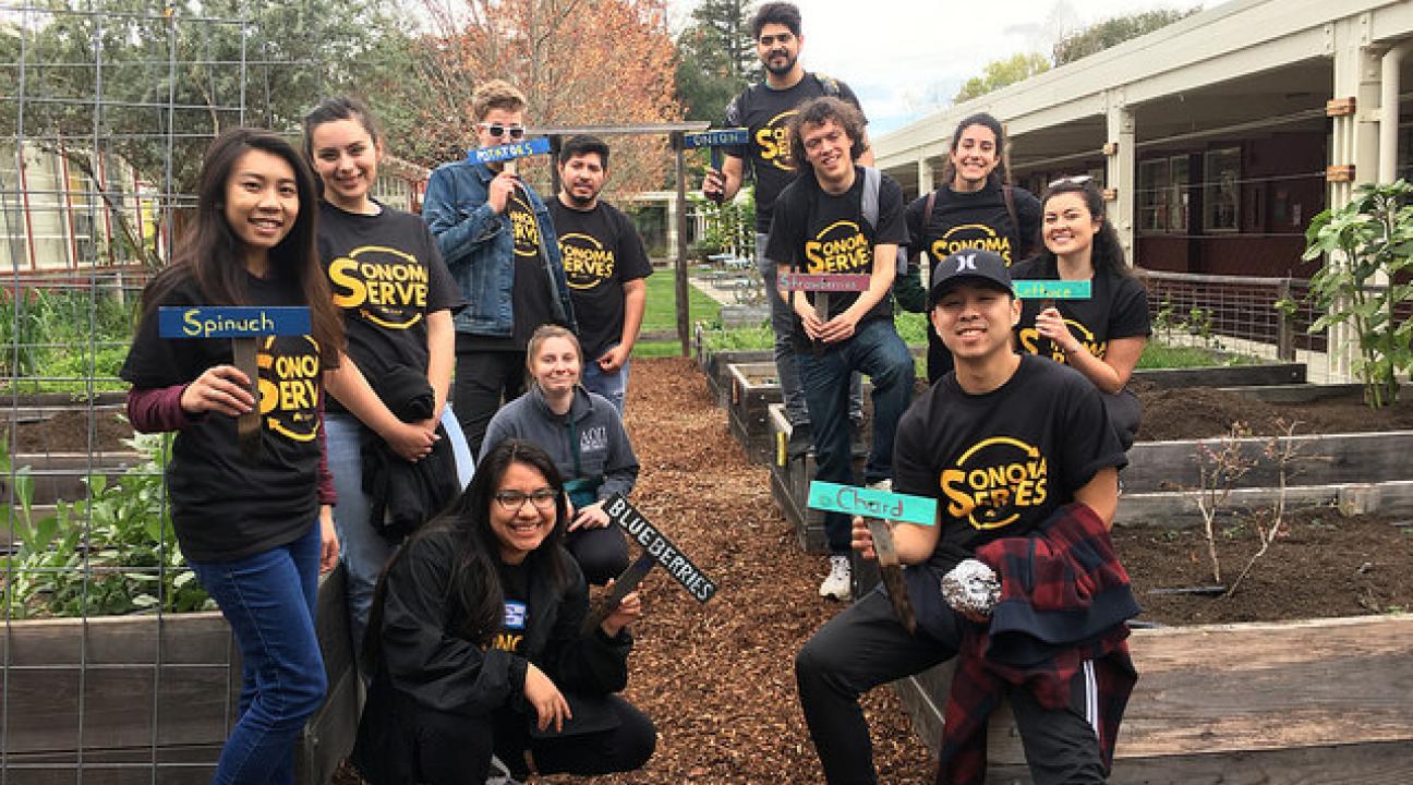 A group of students poses for a photo at Sonoma Serves
