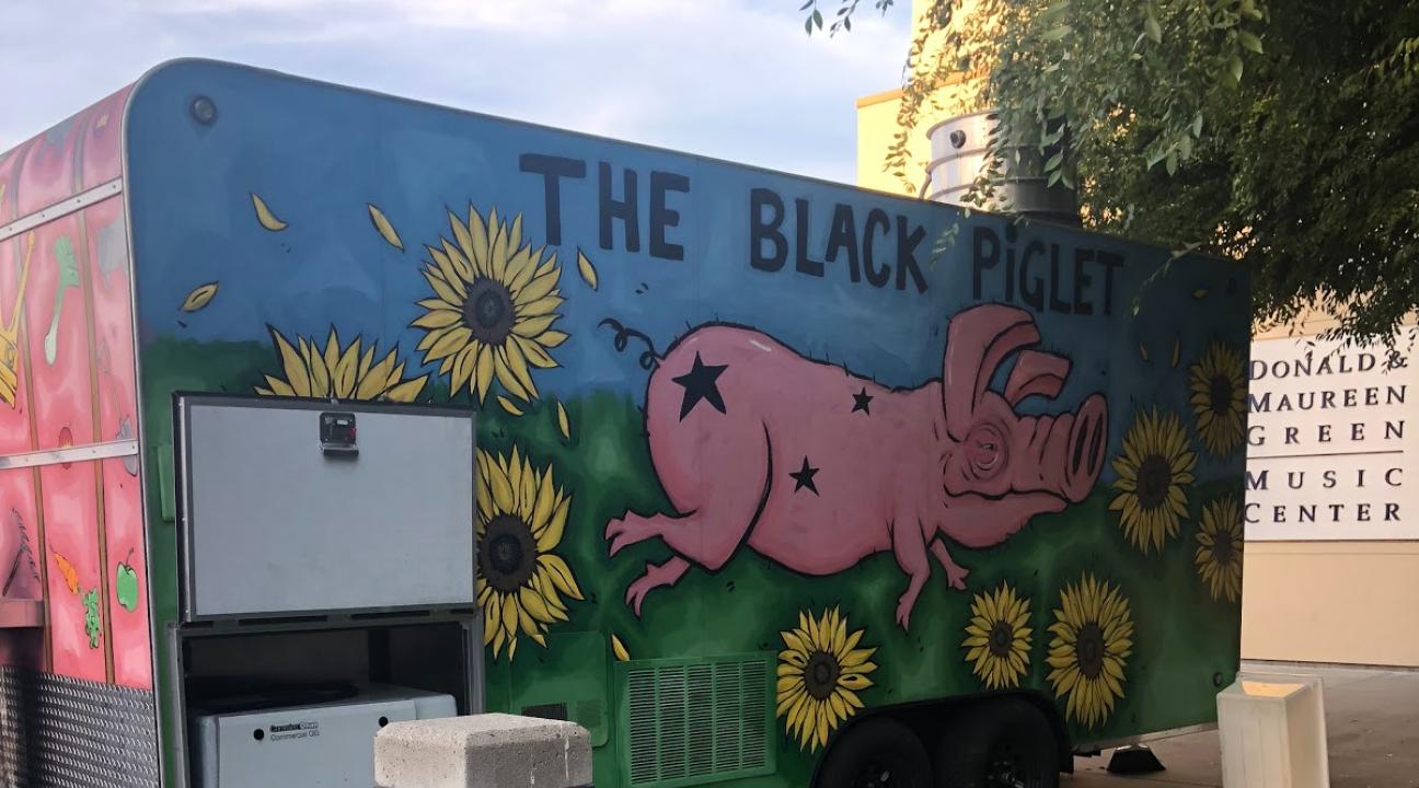 The Black Piglet (vendor) parked outside the GMC
