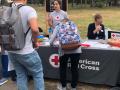 Student at the Red Cross table at the Fair