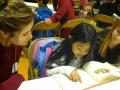 A Luther Burbank Elementary School student reading a book to an SSU service-learner at Book Buddies