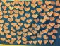 Paper hearts attached to a blue backdrop