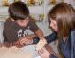 Max Breal and SSU service-learning Anna Gavin work together on a puzzle.