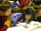 A Luther Burbank Elementary School student reading a book to an SSU service-learner at Book Buddies