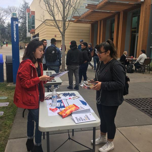 Jackeline giving a student more information on what the Peace Corps entails