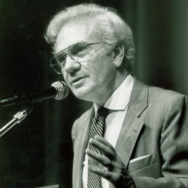 Ernest L Boyer at a podium