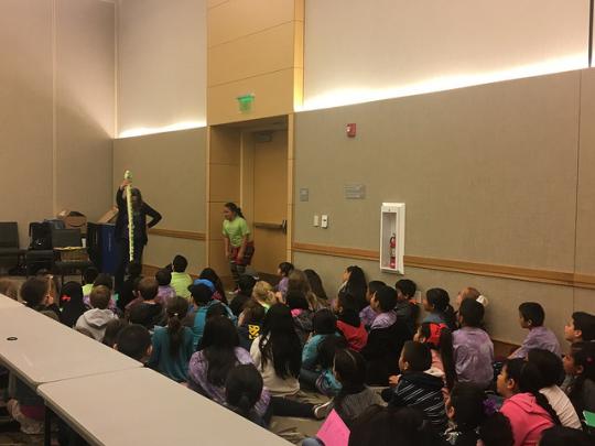 The kids interacting with storyteller, Laurie Cameron