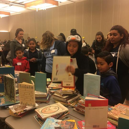 The kids choosing their books with their buddies