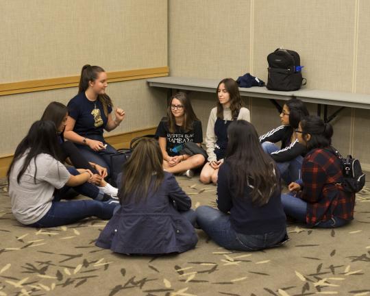 A small group of students listening to their SSU guide during discovery day