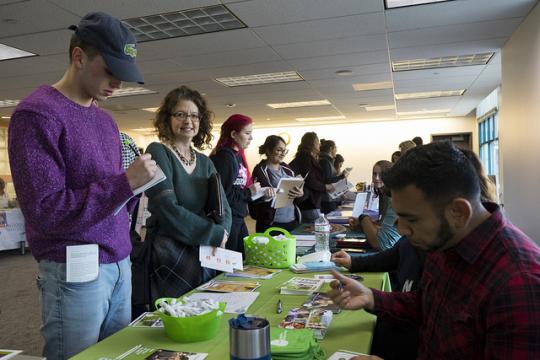 Students getting info at the fair