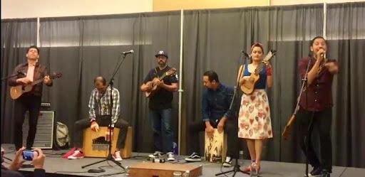 Las Cafeteras, on stage playing music