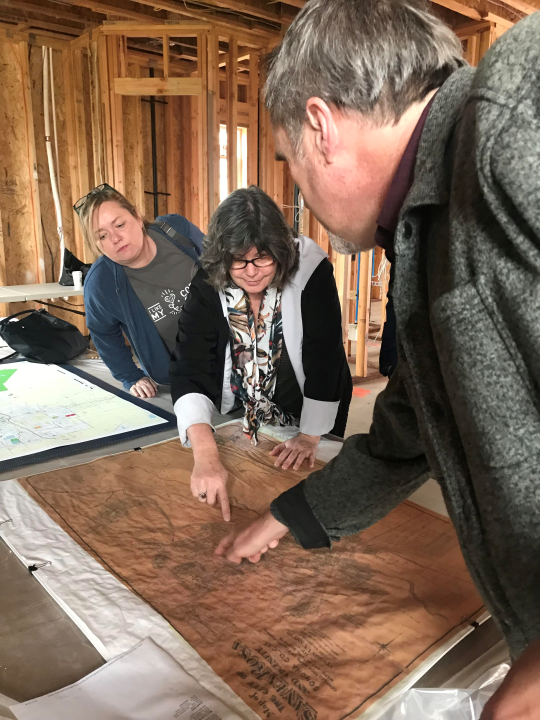 Dr. Margaret Purser pinpointing out what used to be two railroad systems in Santa Rosa map from 1886. 