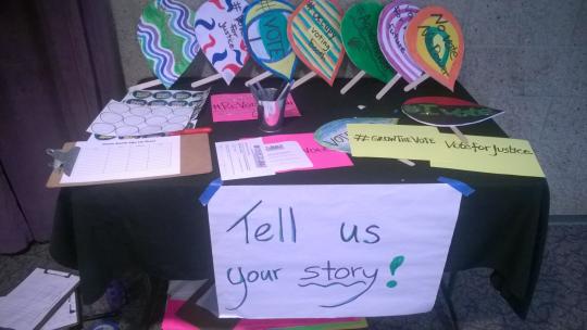 A table outside the meeting encouraging people to vote.