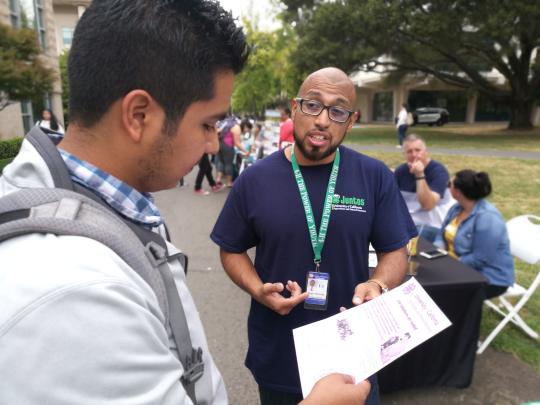 Student talking to 4H representative, Diego Mariscal.