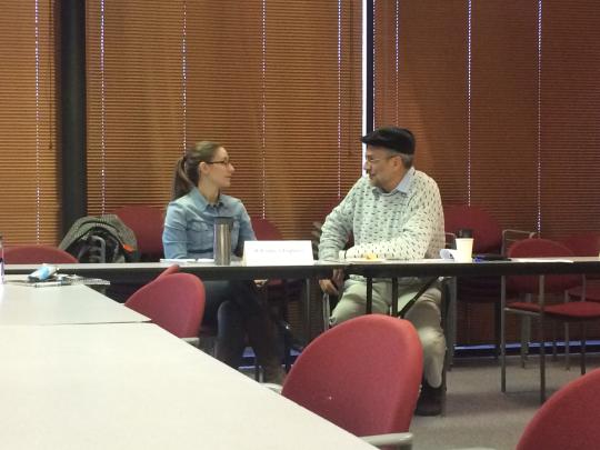 Two professionals networking before the Roundtable started.