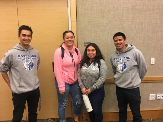 Juniors from Roseland Collegiate Prep smile with their teachers, wearing the gray sweatshirts. 