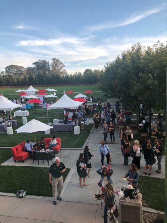 people outside attending vendor booths