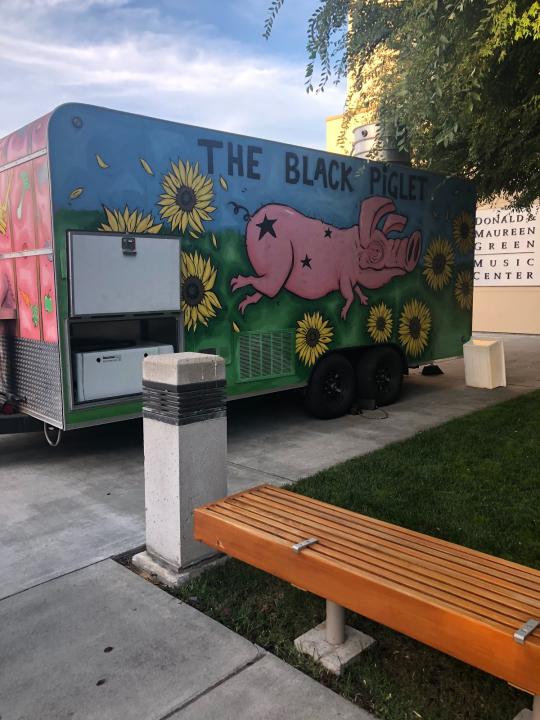 The Black Piglet (vendor) parked outside the GMC